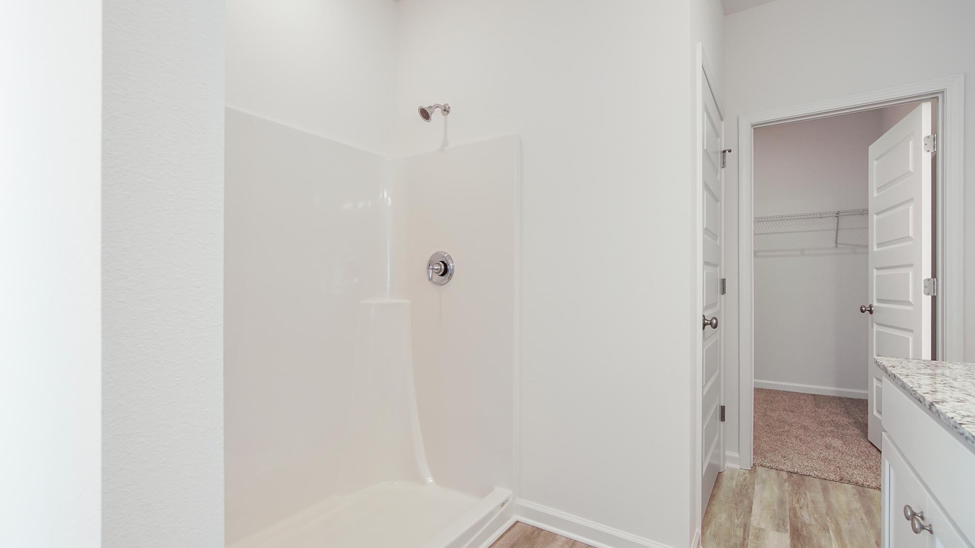 The primary bathroom has EVP flooring