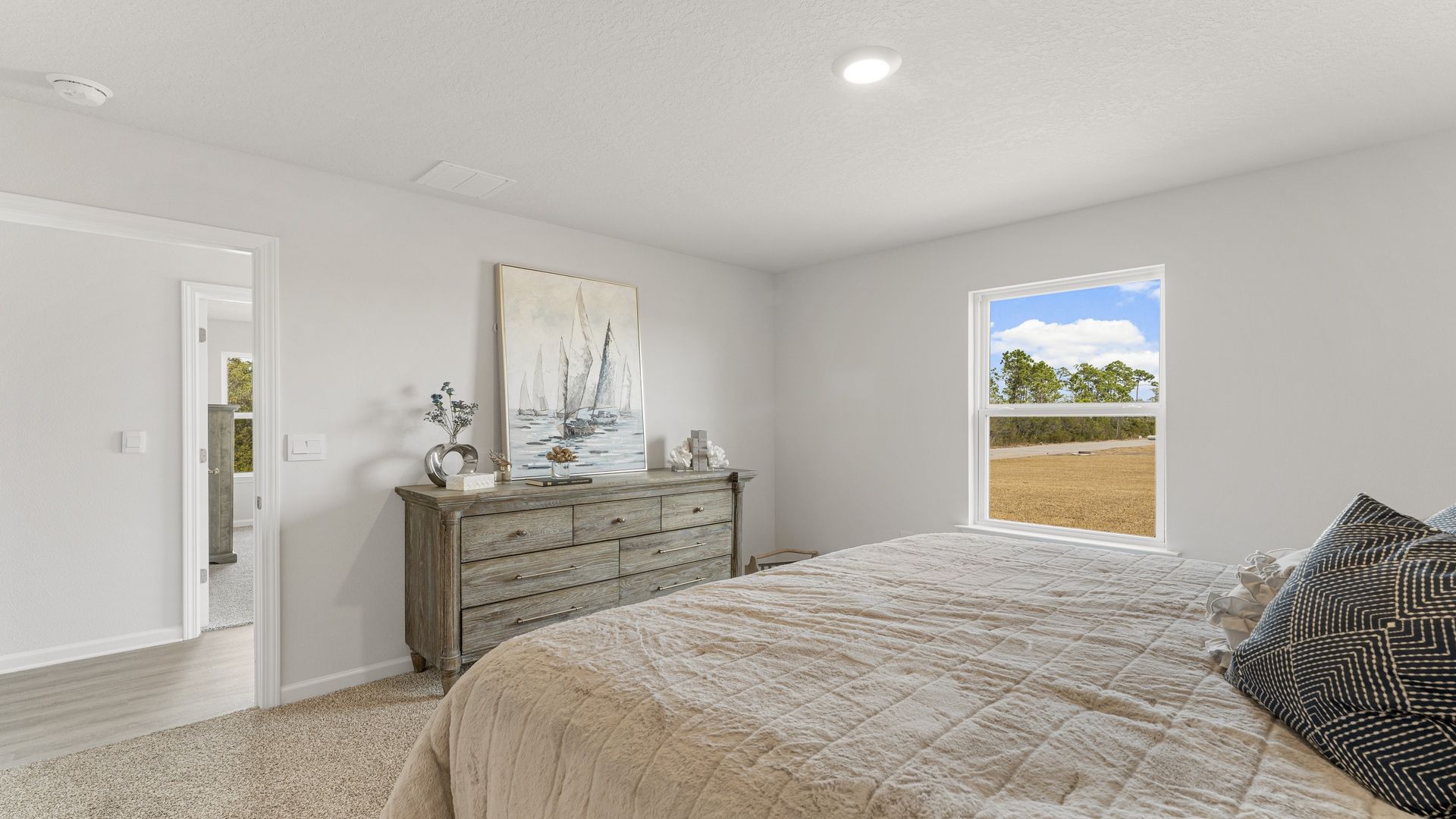 Primary bedroom with carpet