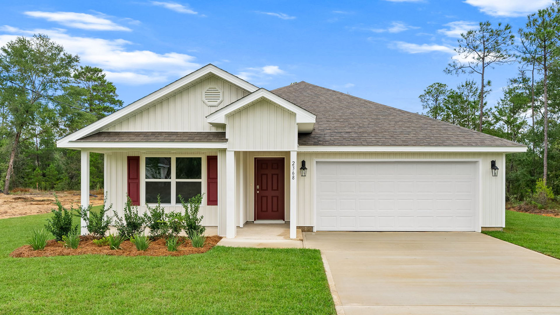 This image shows a similar Lily floorplan at completion with blue exterior, white garage and a covered front patio at completion Cali floor plan at completion