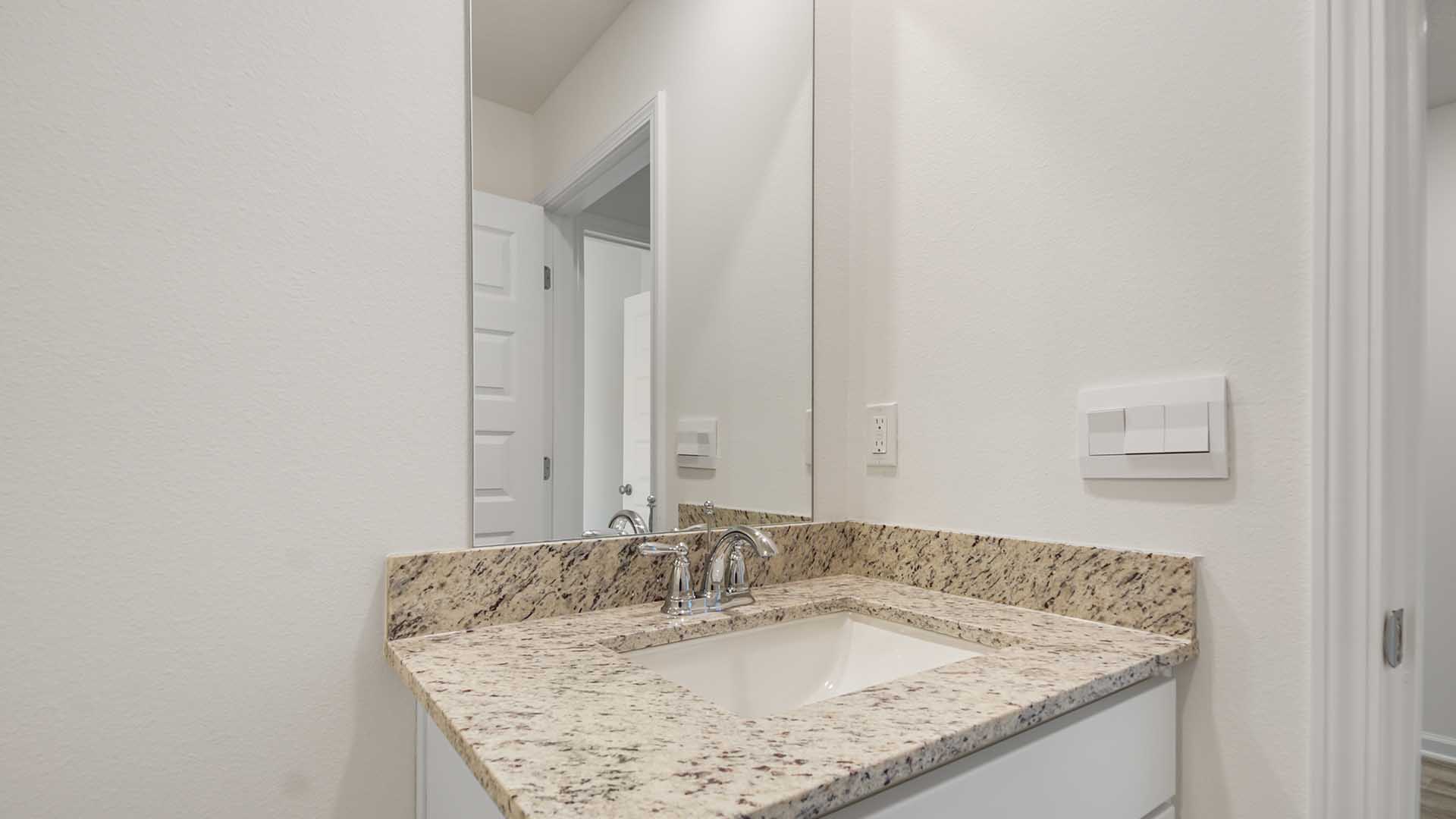 There is a shared bathroom with single vanity between bedrooms two and three