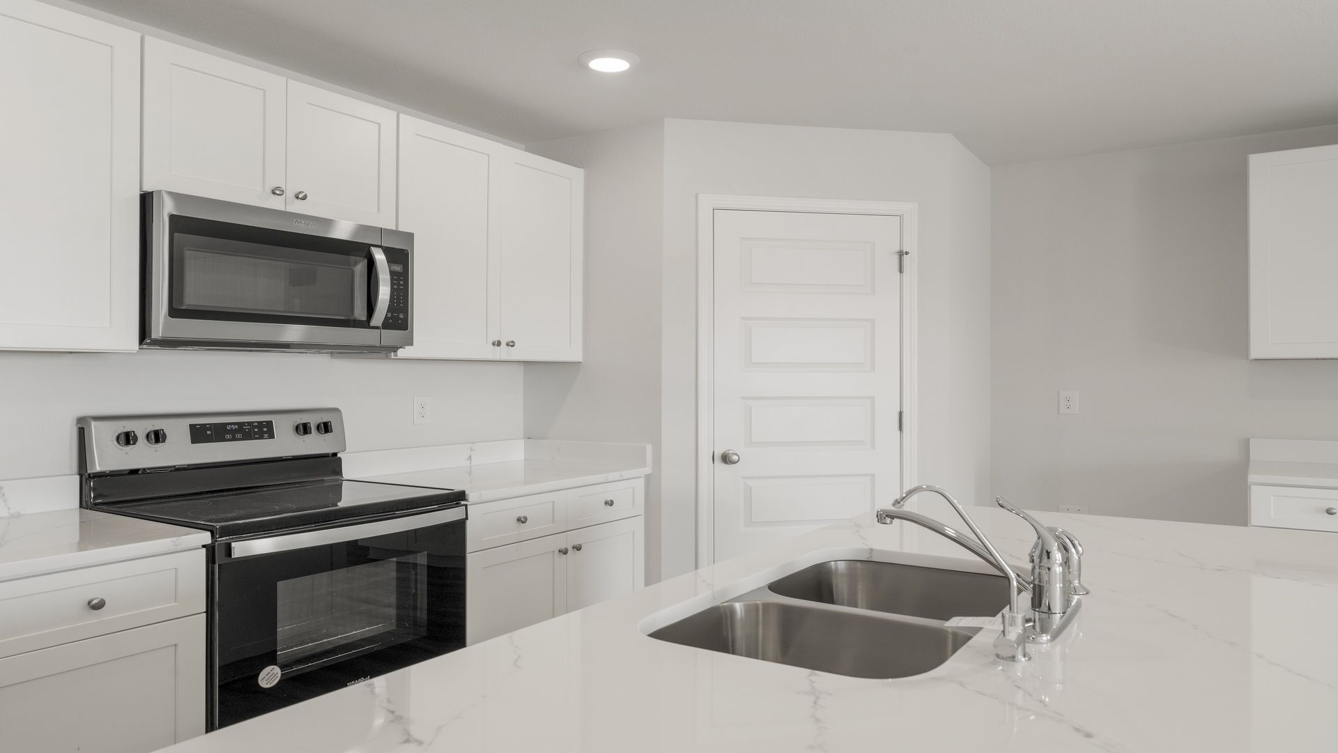 The kitchen has quartz countertops