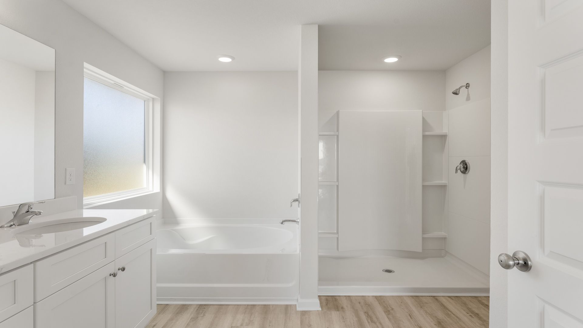 The primary bathroom has a separate soak tub