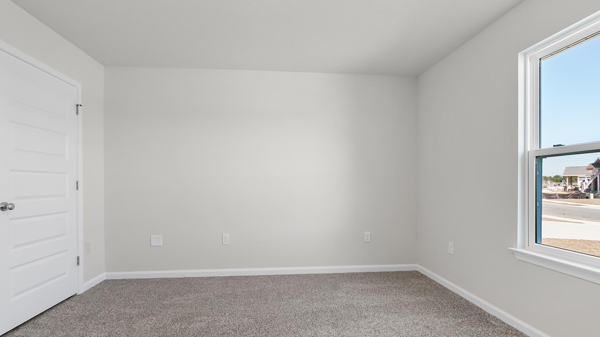 Bedroom two has a large picture window