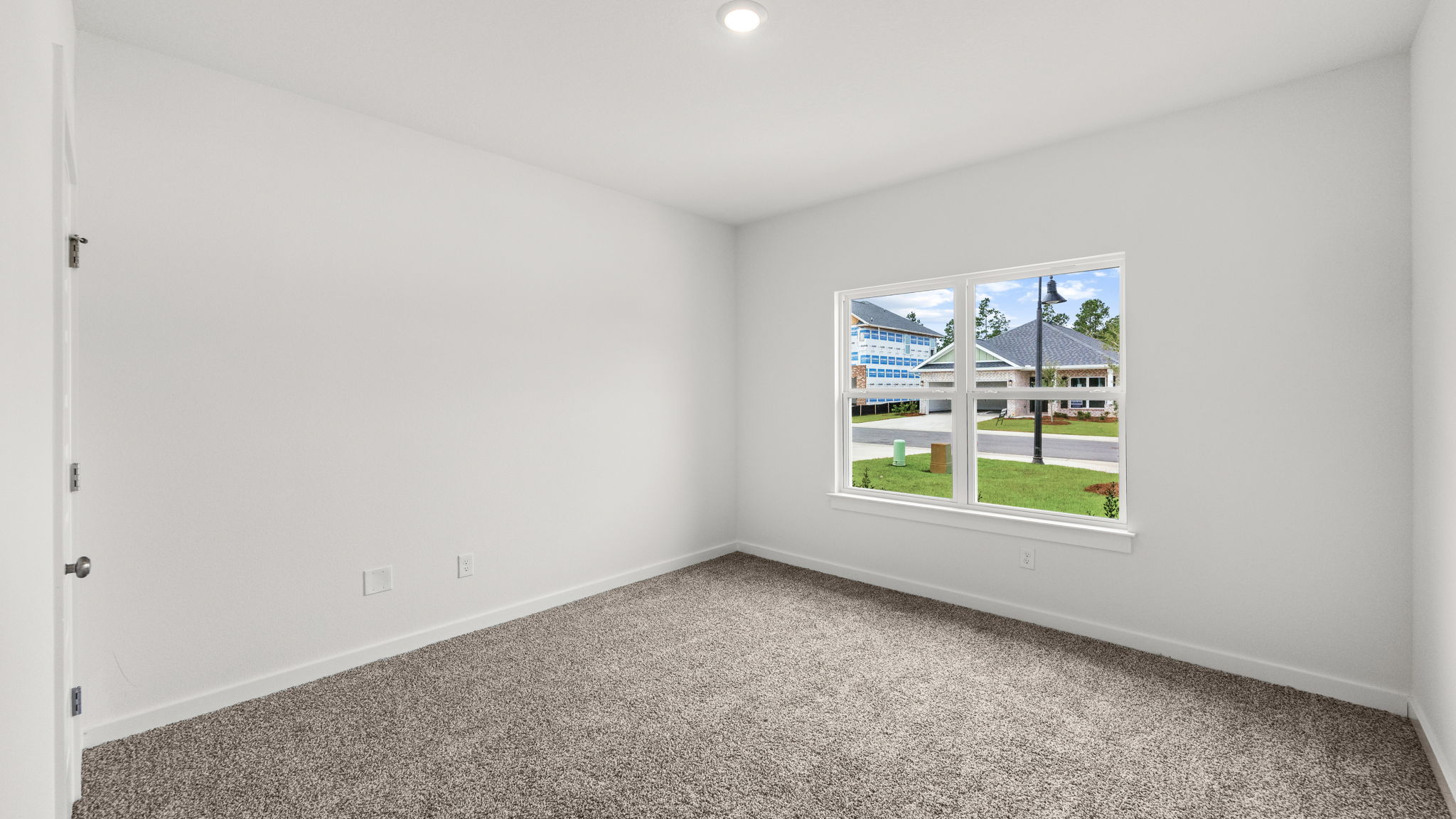 The shared bathroom is next to bedroom two and has a shower tub combination and single vanity