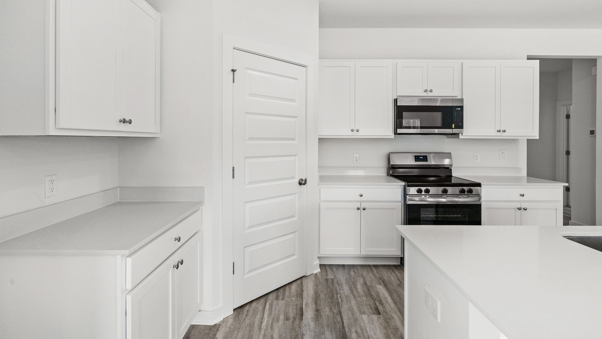 The kitchen has a corner pantry for storage