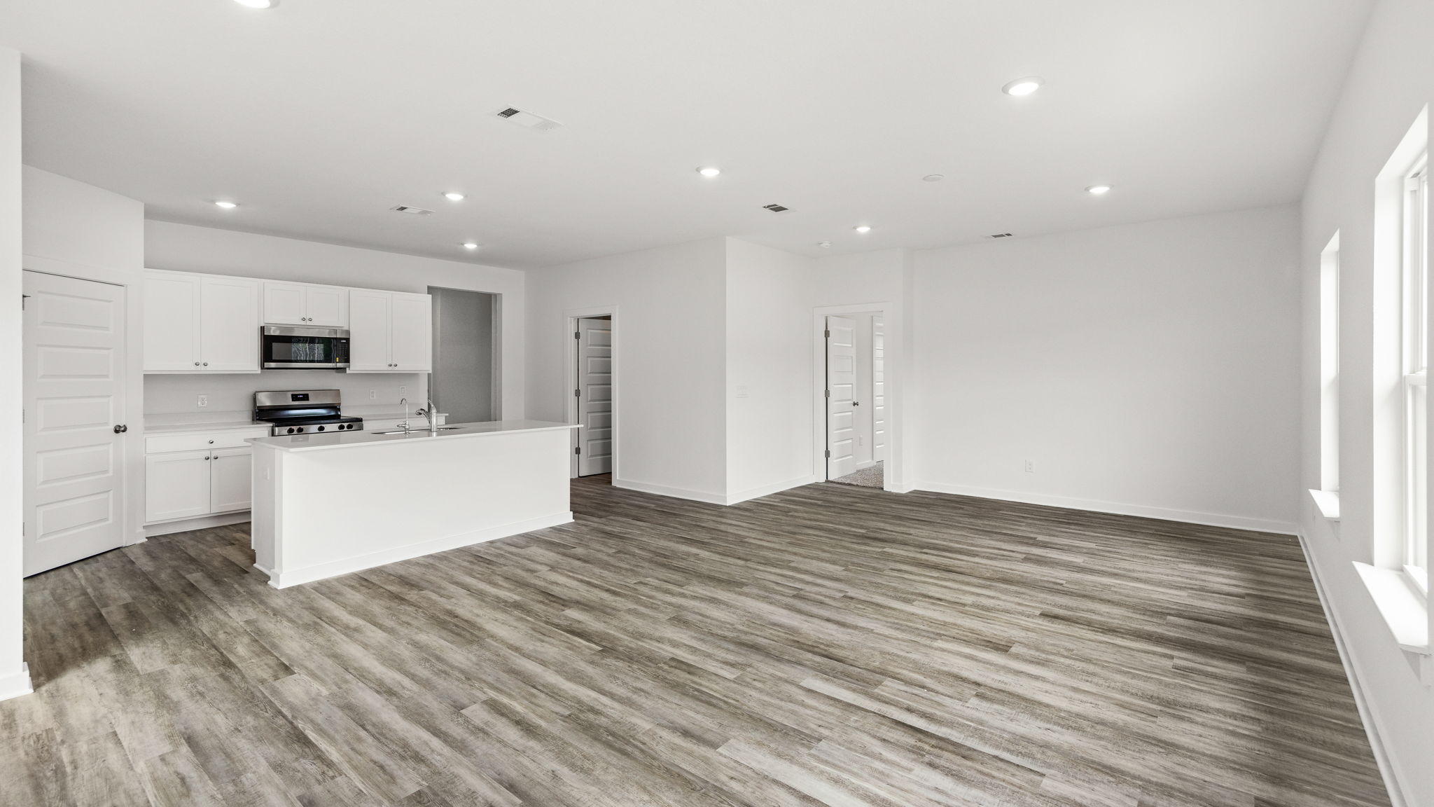 Open concept living area allows for dining space and full living room