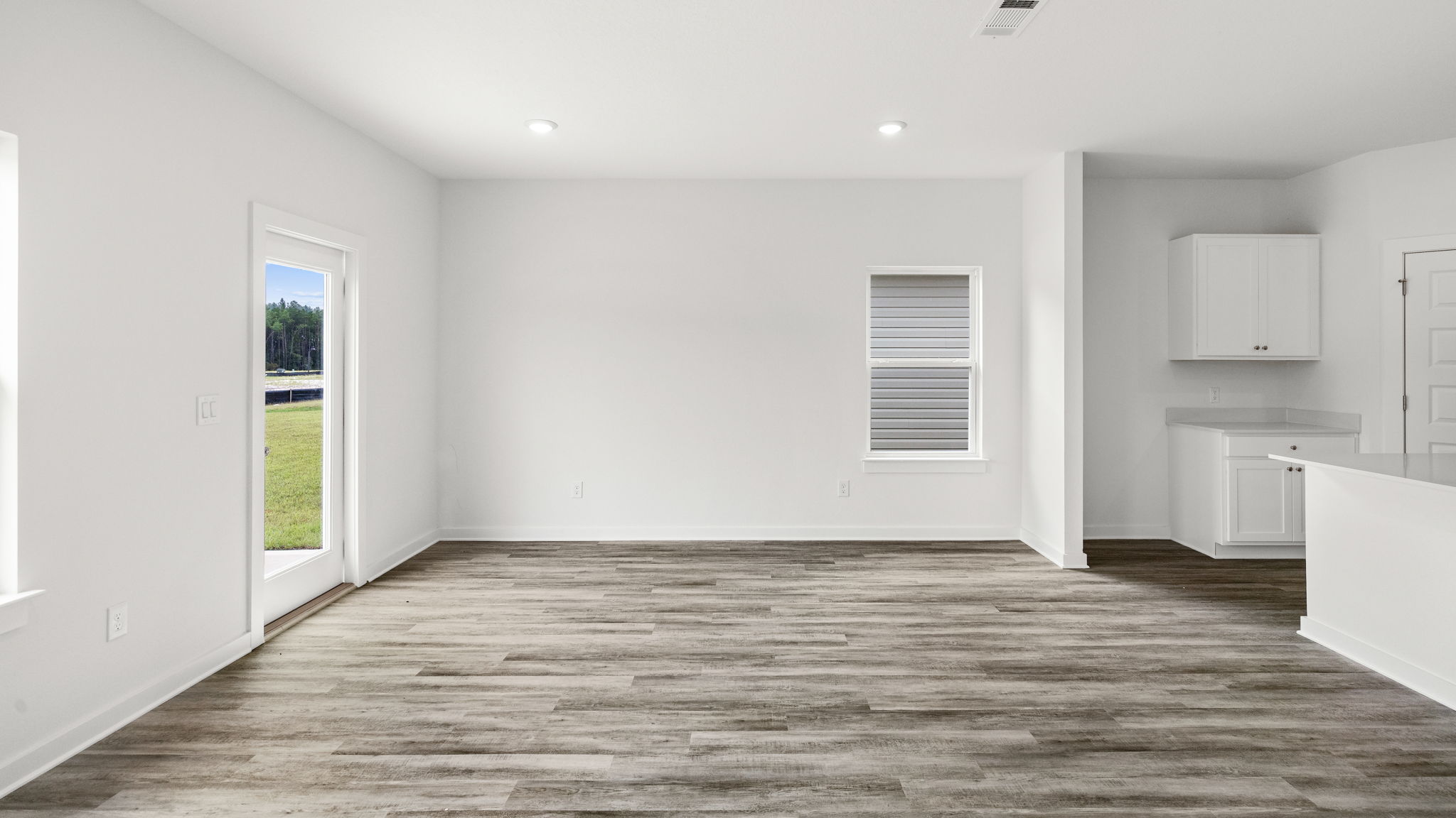 The dining area is located next to the kitchen