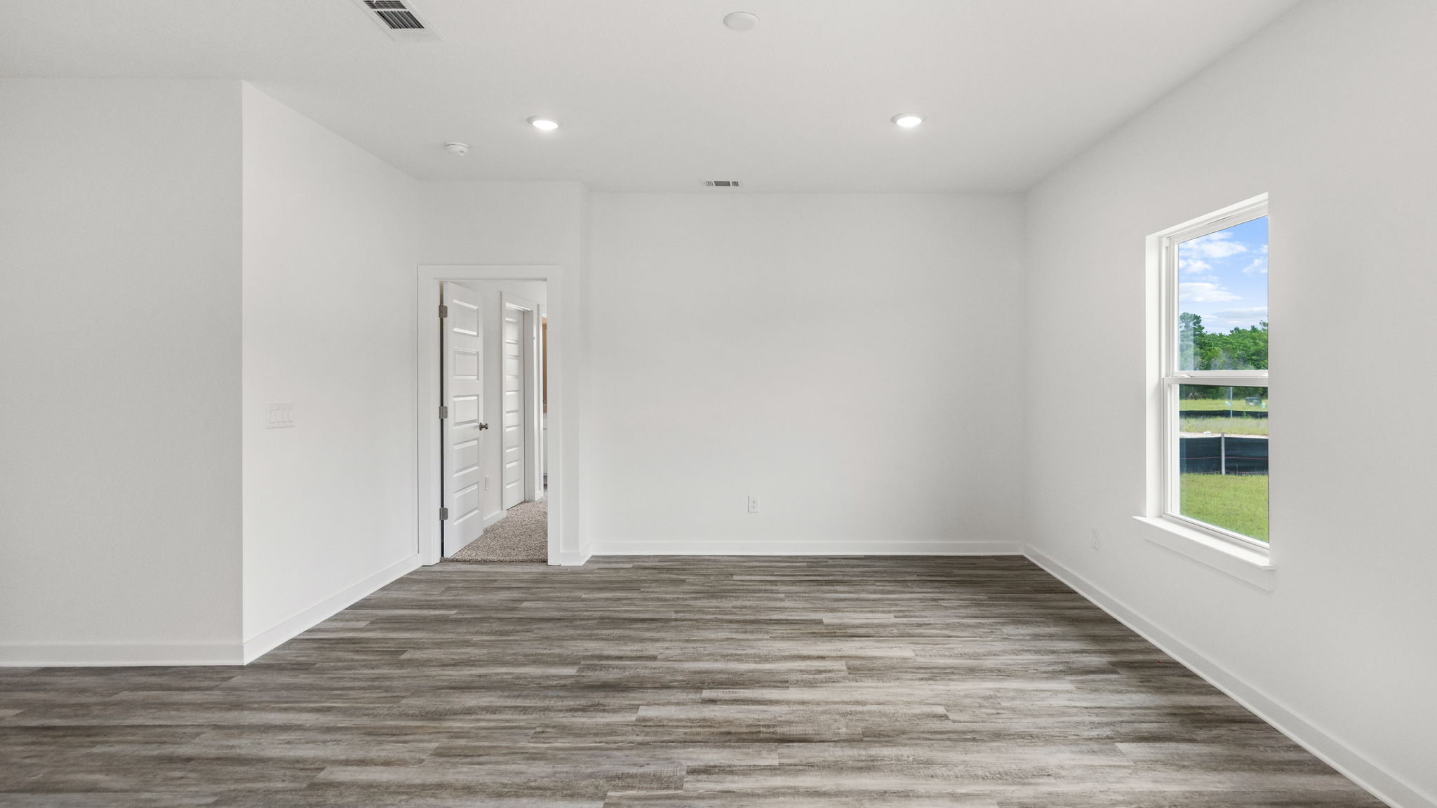 The living area is near the primary bedroom