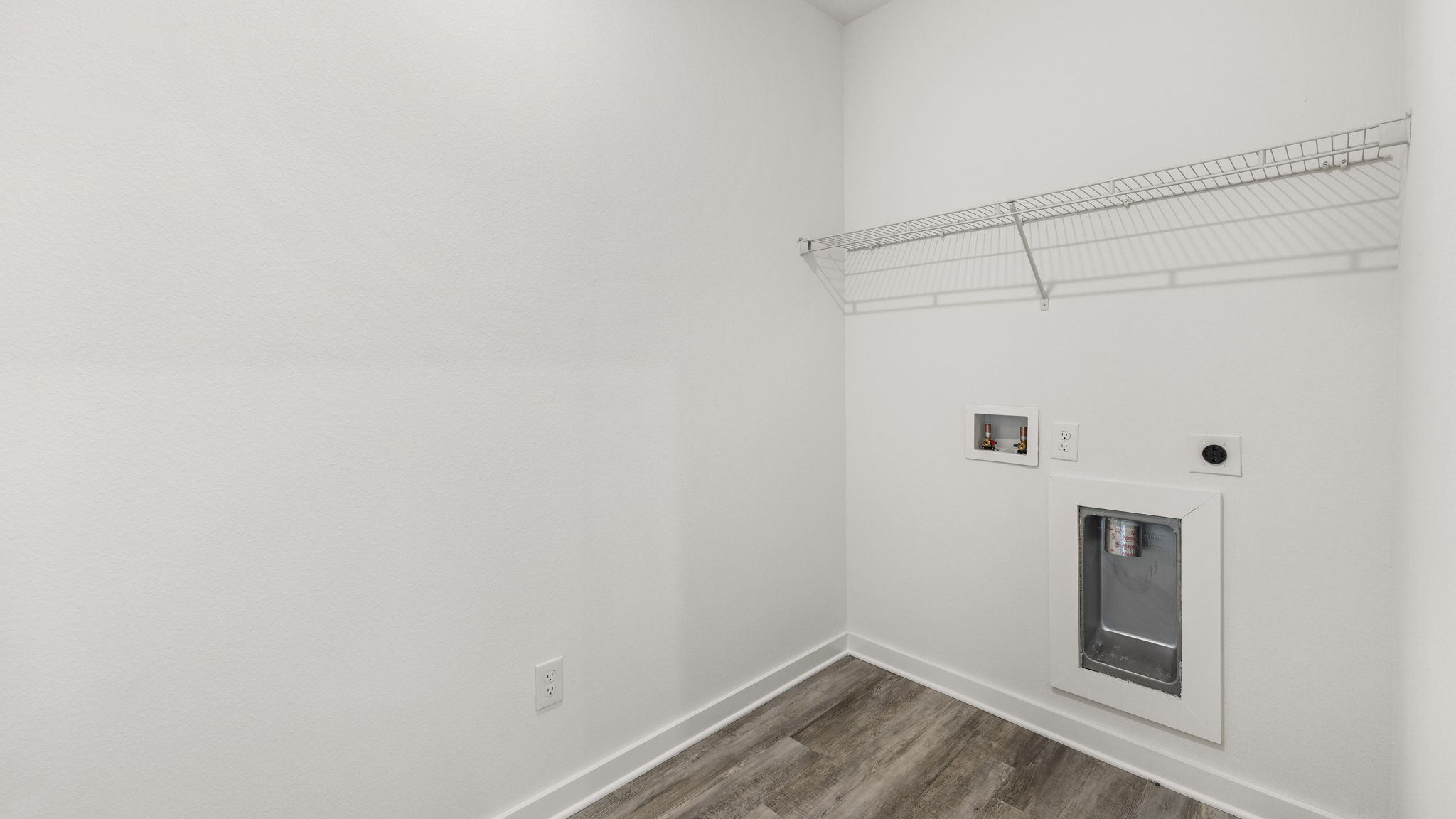 The laundry room is adjacent to the kitchen