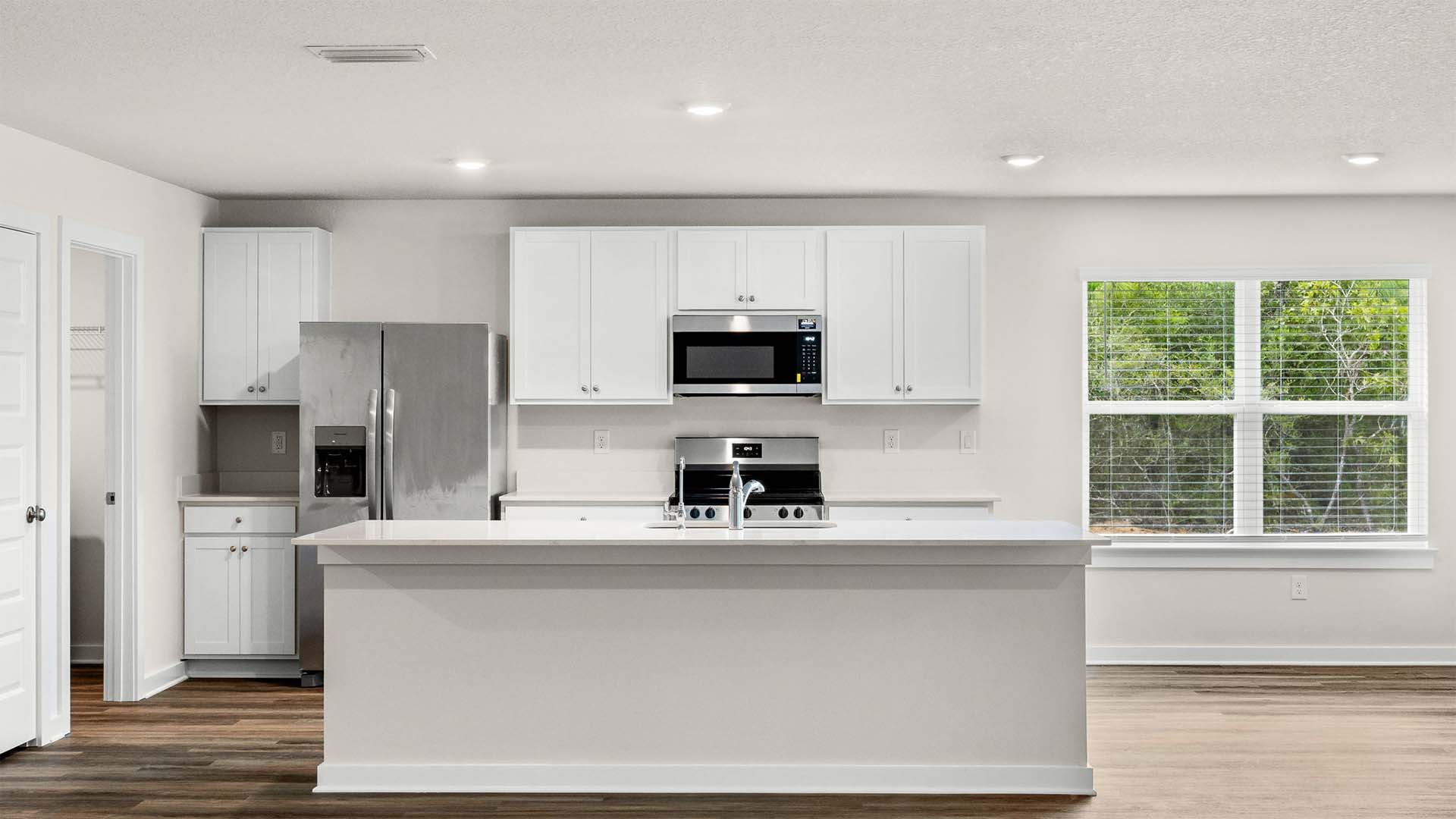 Kitchens showcasing appliances including dishwasher microwave and stove