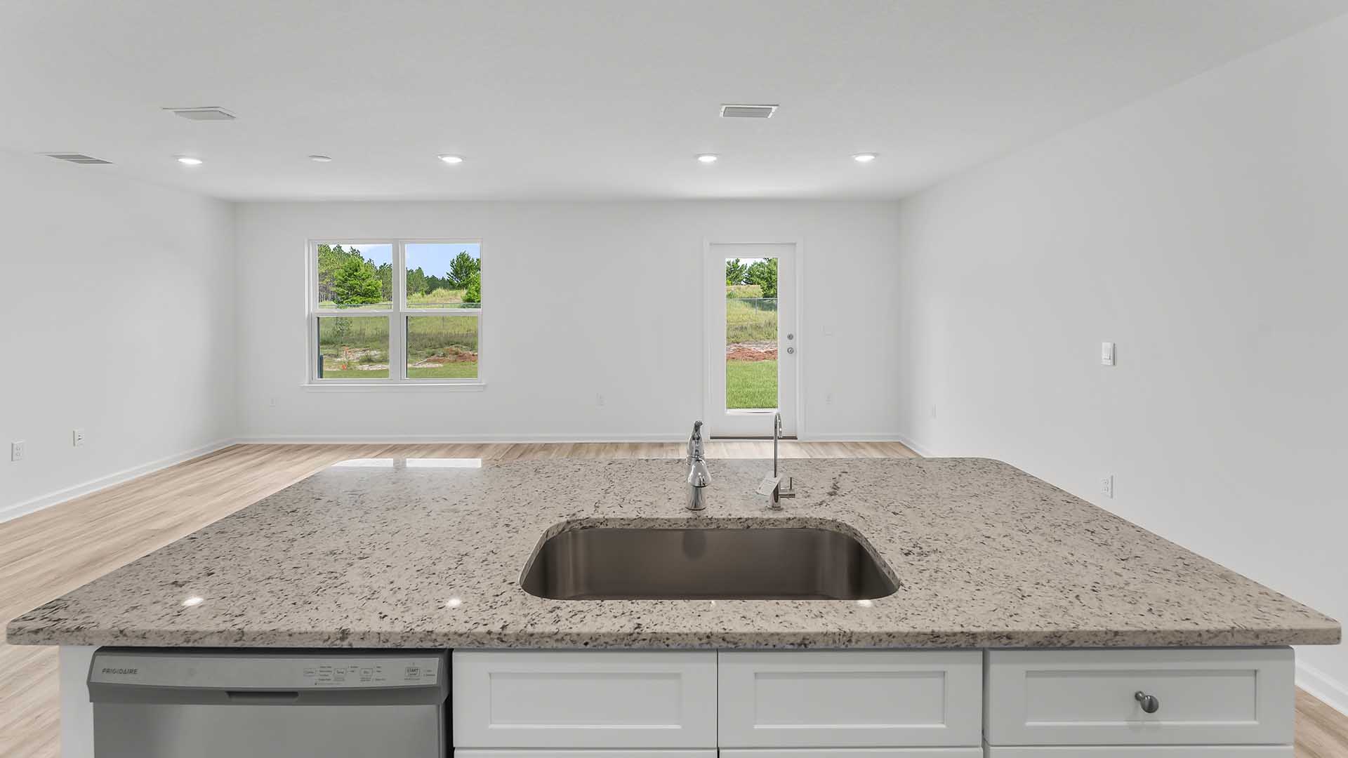 The kitchen is open to the grand living area