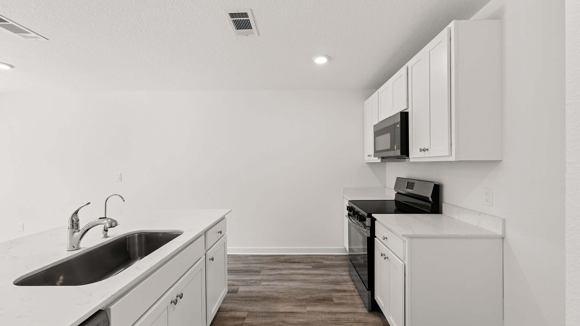 The kitchen has a center island with space for bar seating