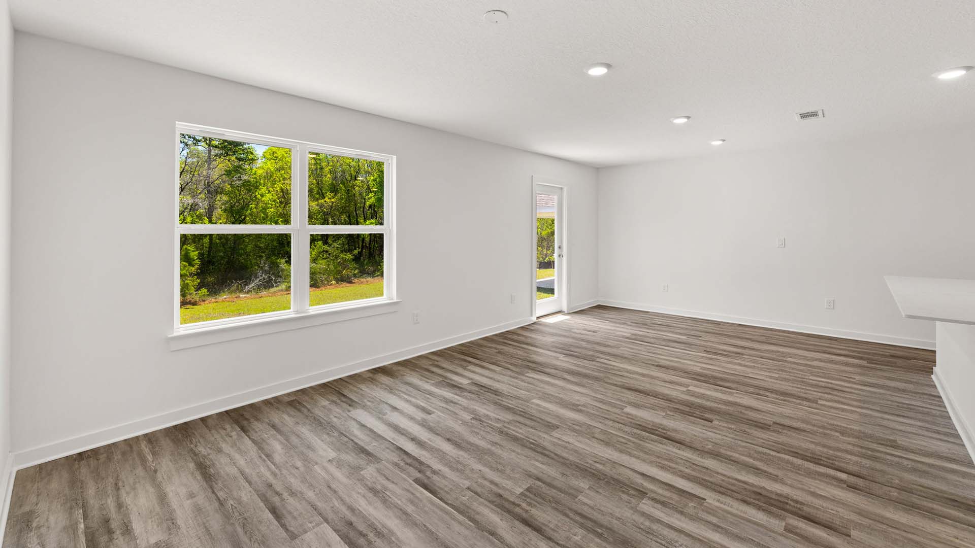 The dining area is just off the kitchen and provides access to the back patio