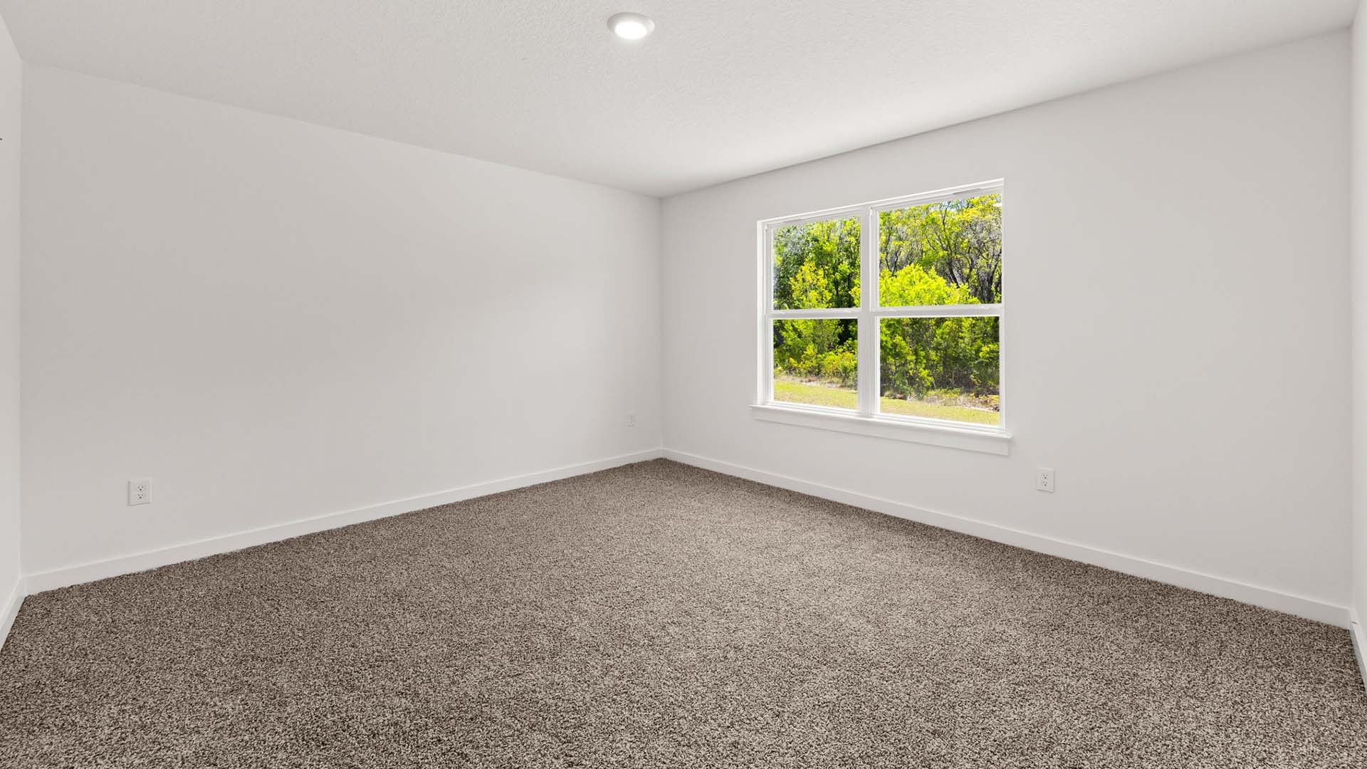 The primary bedroom is located off the living area