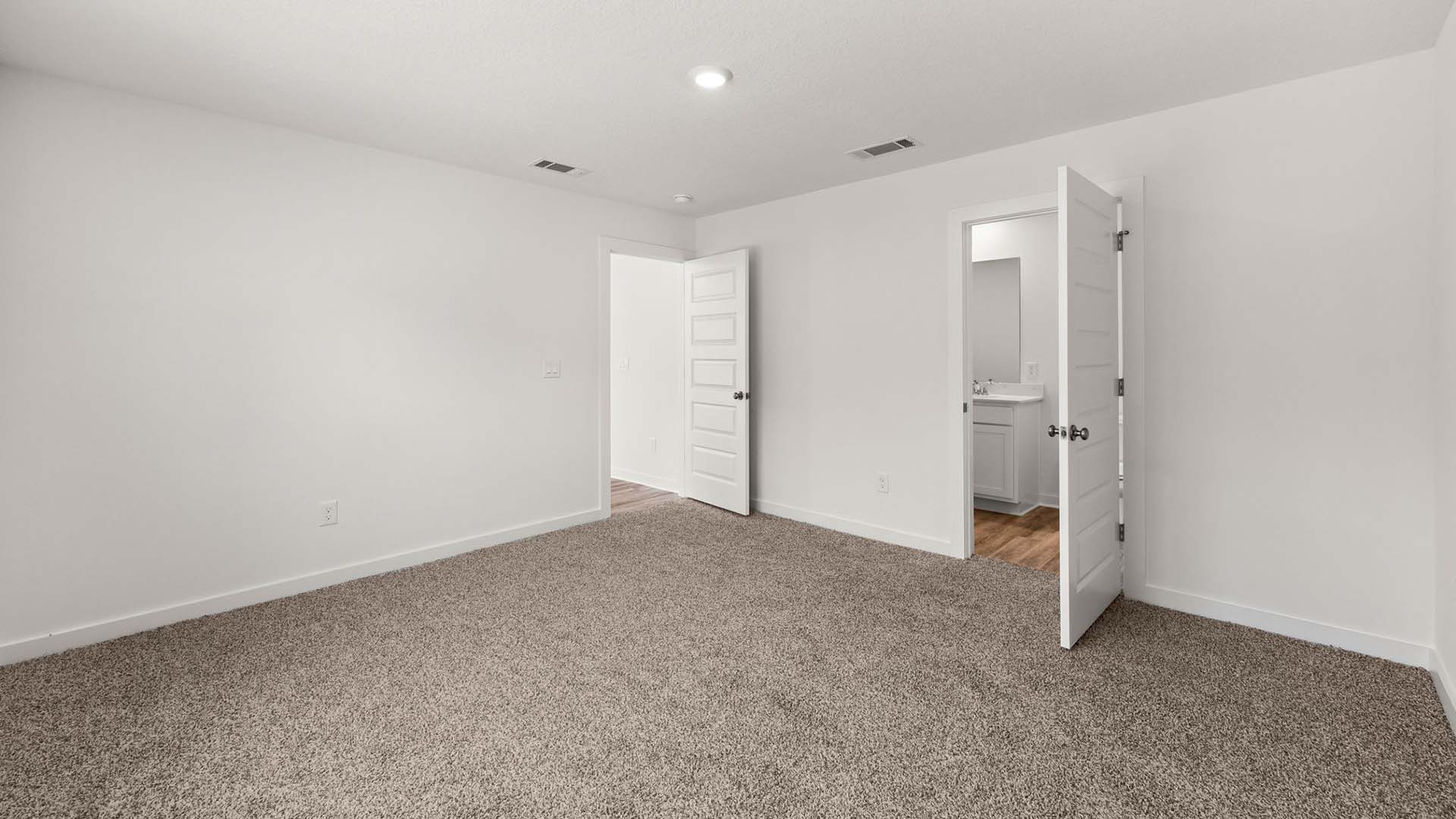 The primary bedroom has carpet