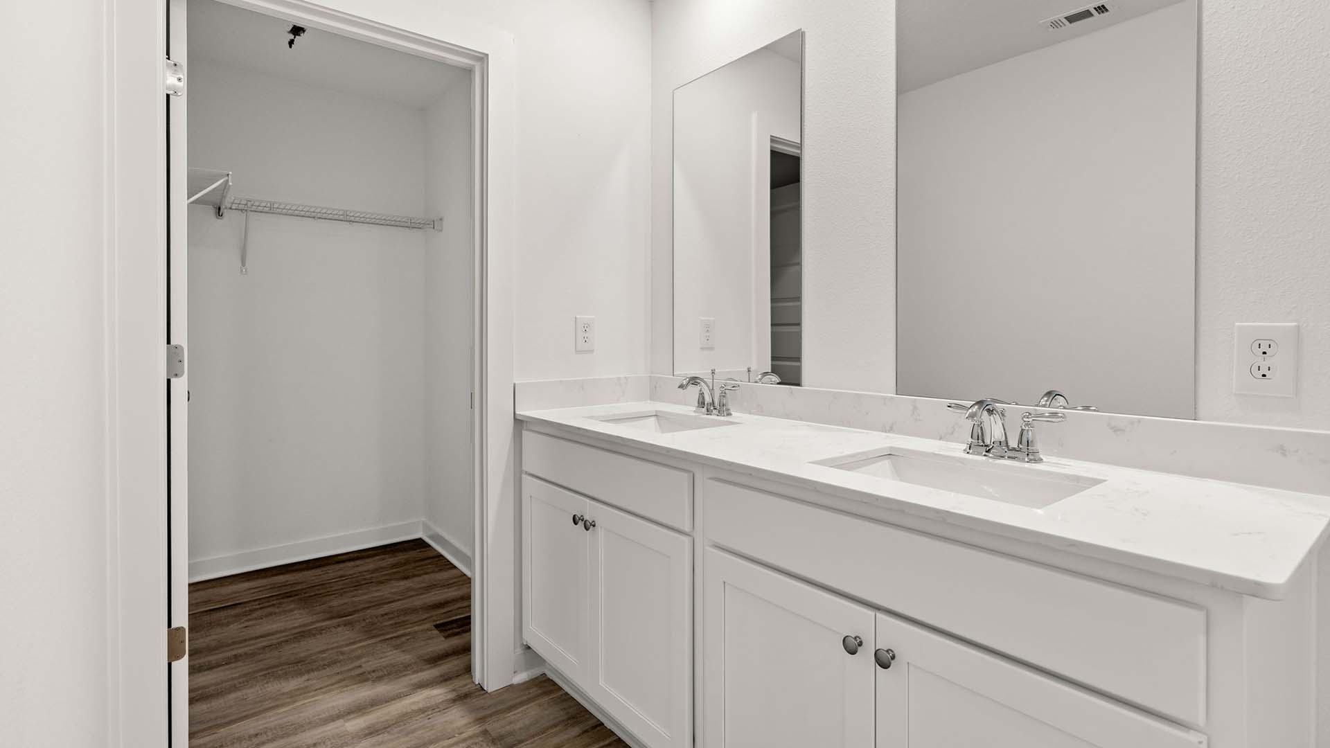 Freeport Primary bath with quartz countertops and a dual sink vanity