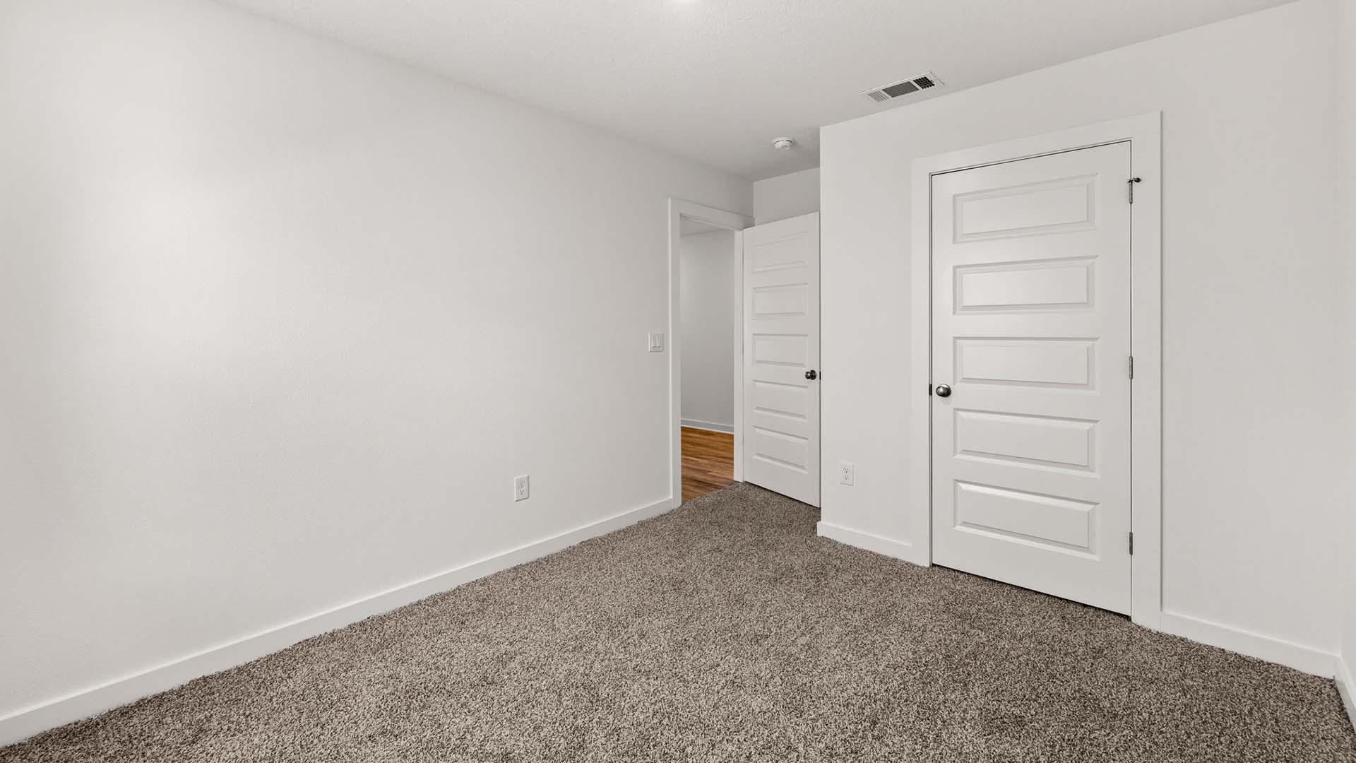 Guest bedroom two with carpet