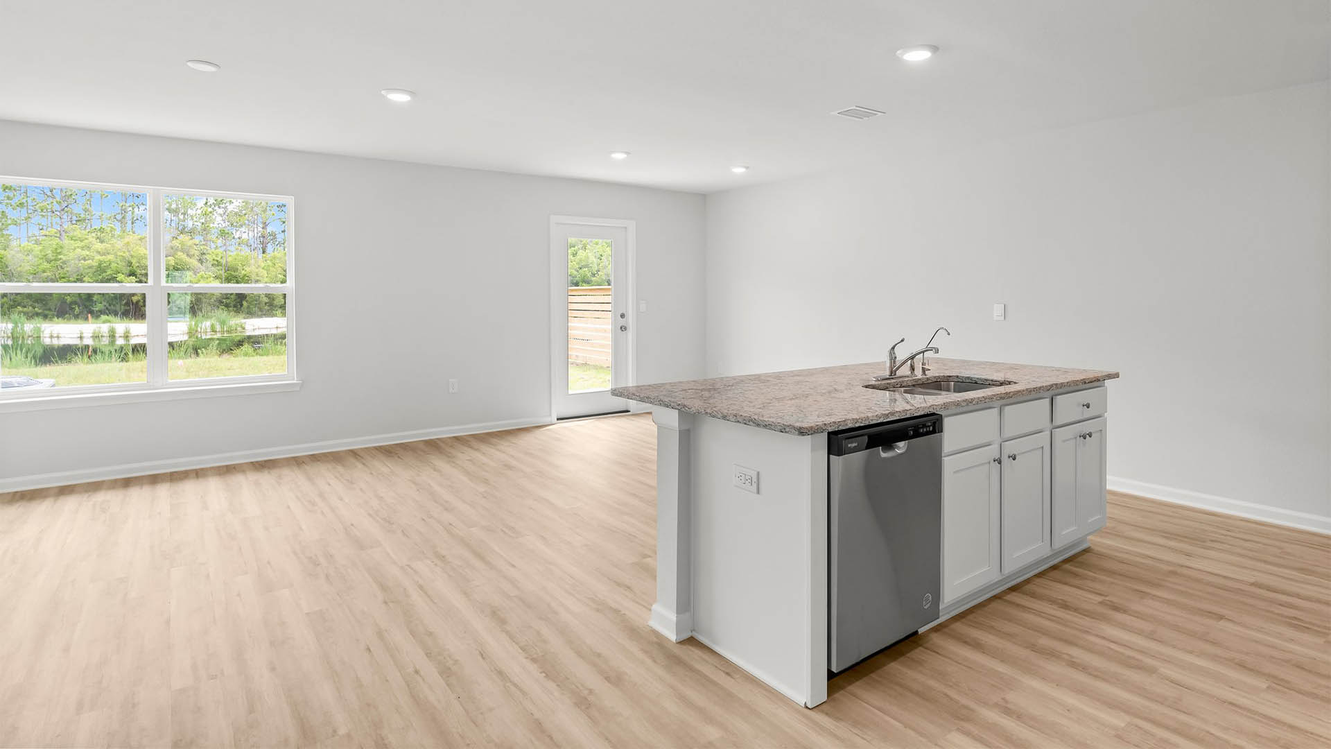 Welcome to the open and spacious kitchen and living area with EVP flooring