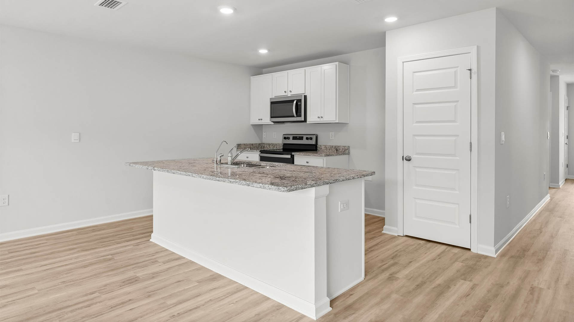 Spacious and open kitchen with EVP flooring