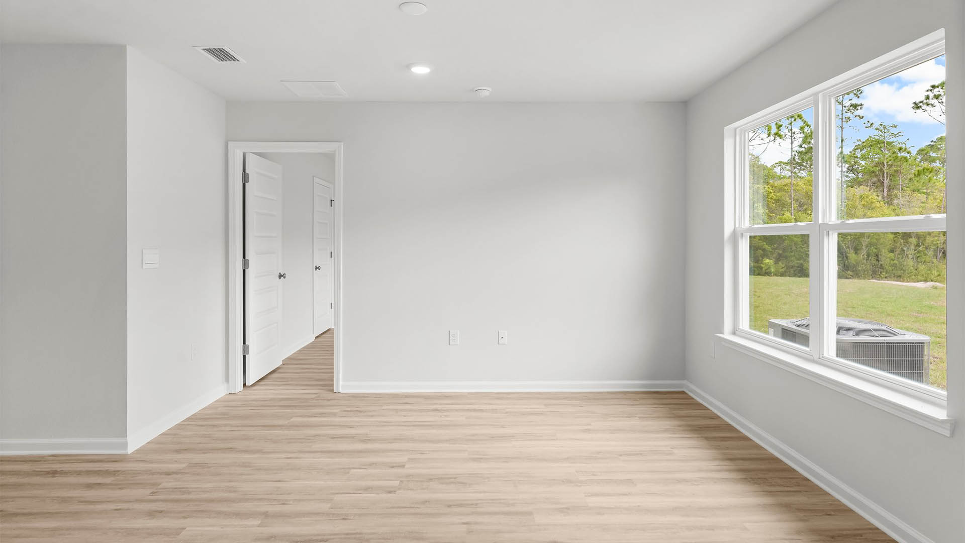 Open living area with picture window allowing for natural light