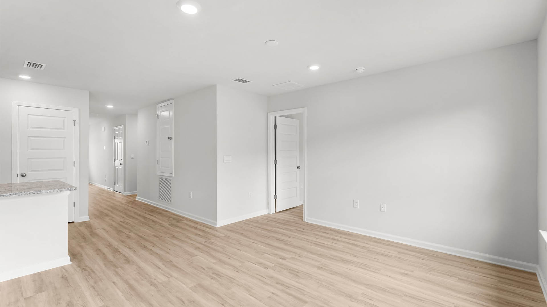 Large living space with EVP flooring throughout the common areas