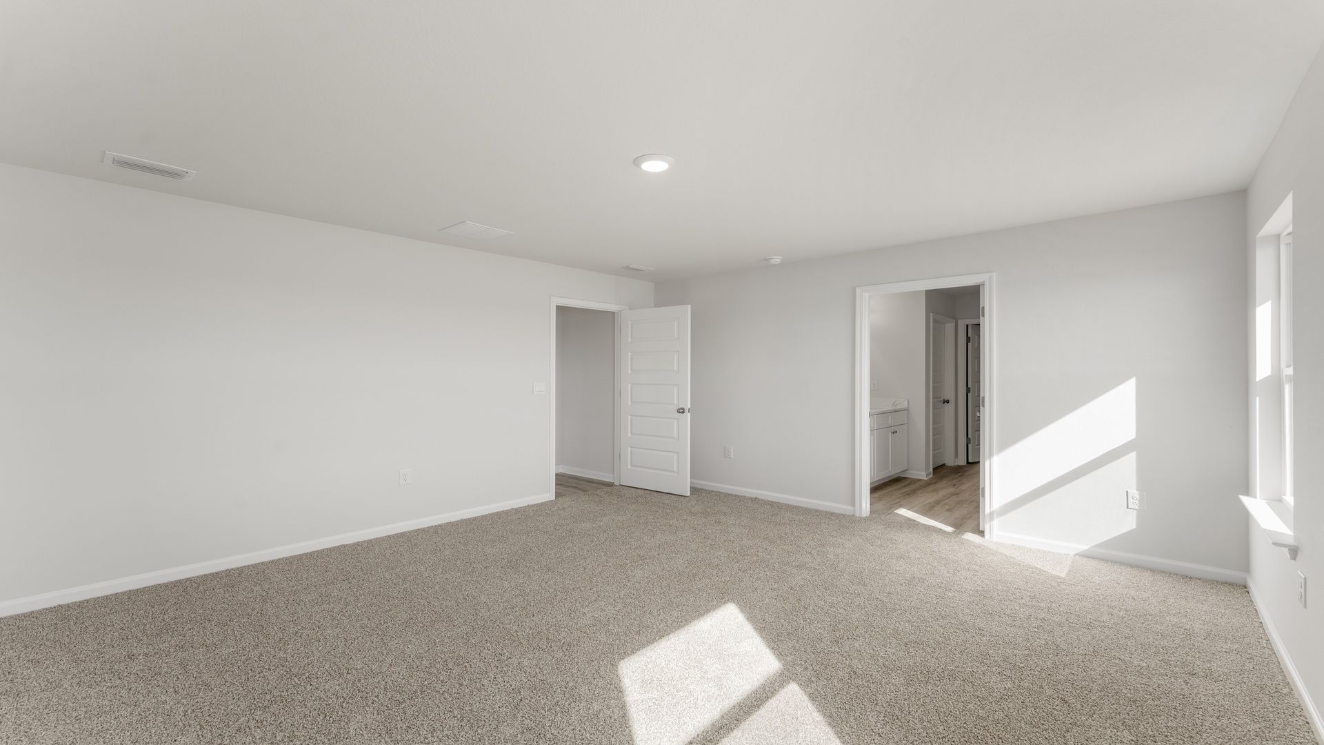 The primary bedroom features a private bathroom