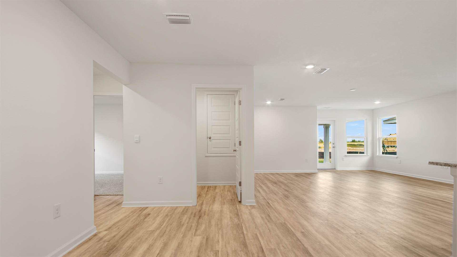 Enter into the living area and featuring 8 foot ceilings
