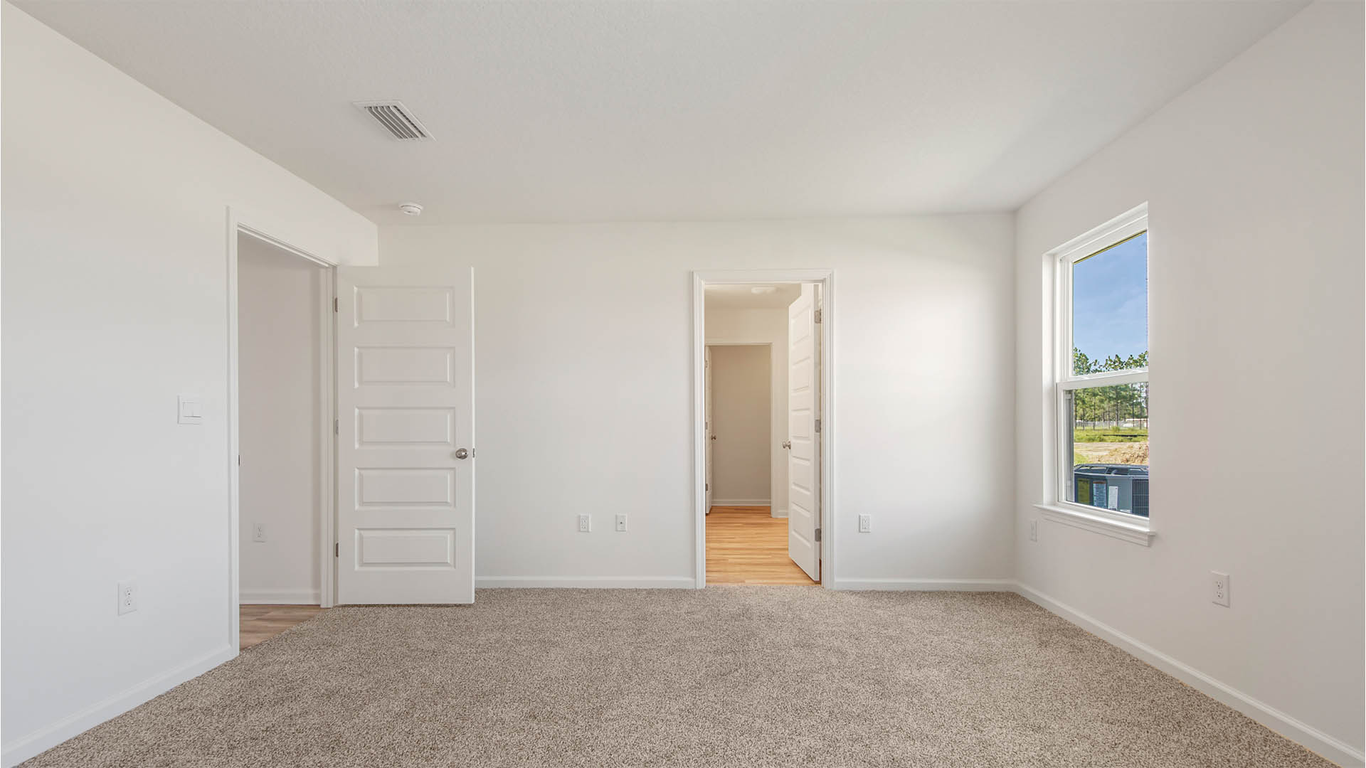 The primary bedroom features a private bathroom