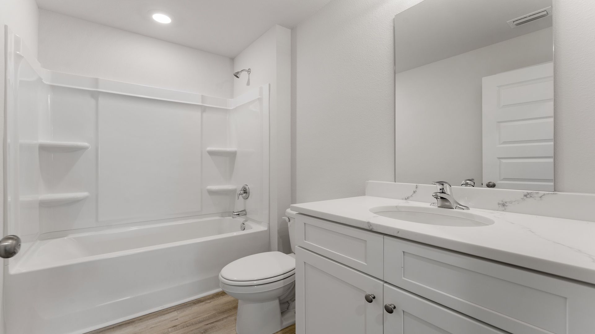 Shared bathroom two has a single basin sink and shower tub combination