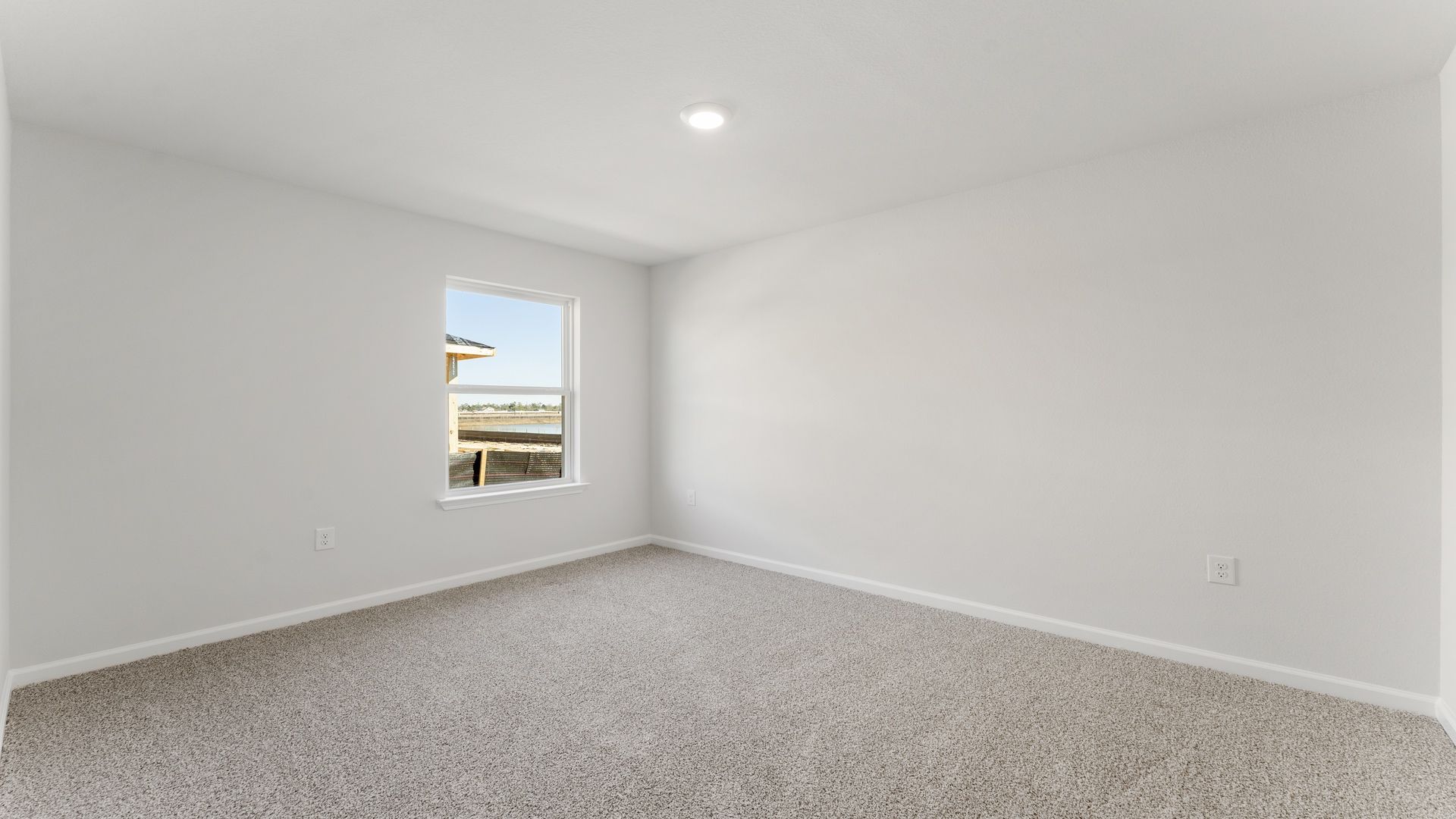 Guest bedroom number three has carpet