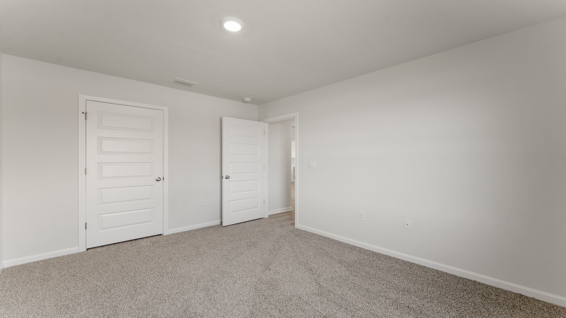 Guest bedroom three has ample closet space