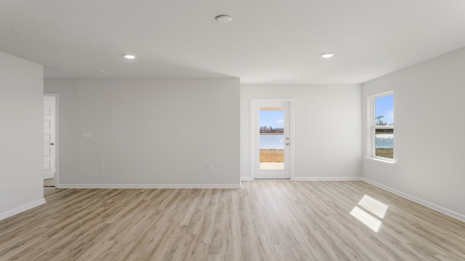 The open concept living area has an appointed space for dining area