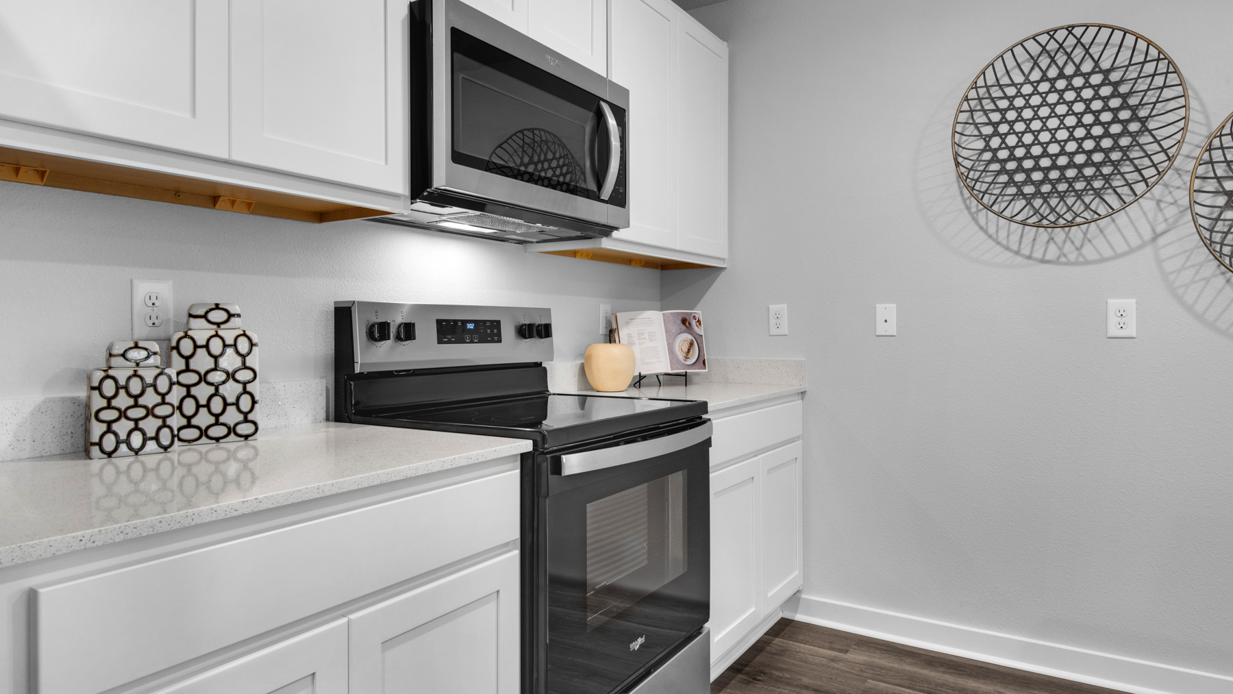 There is counterspace to the sides of the stove and overhead microwave