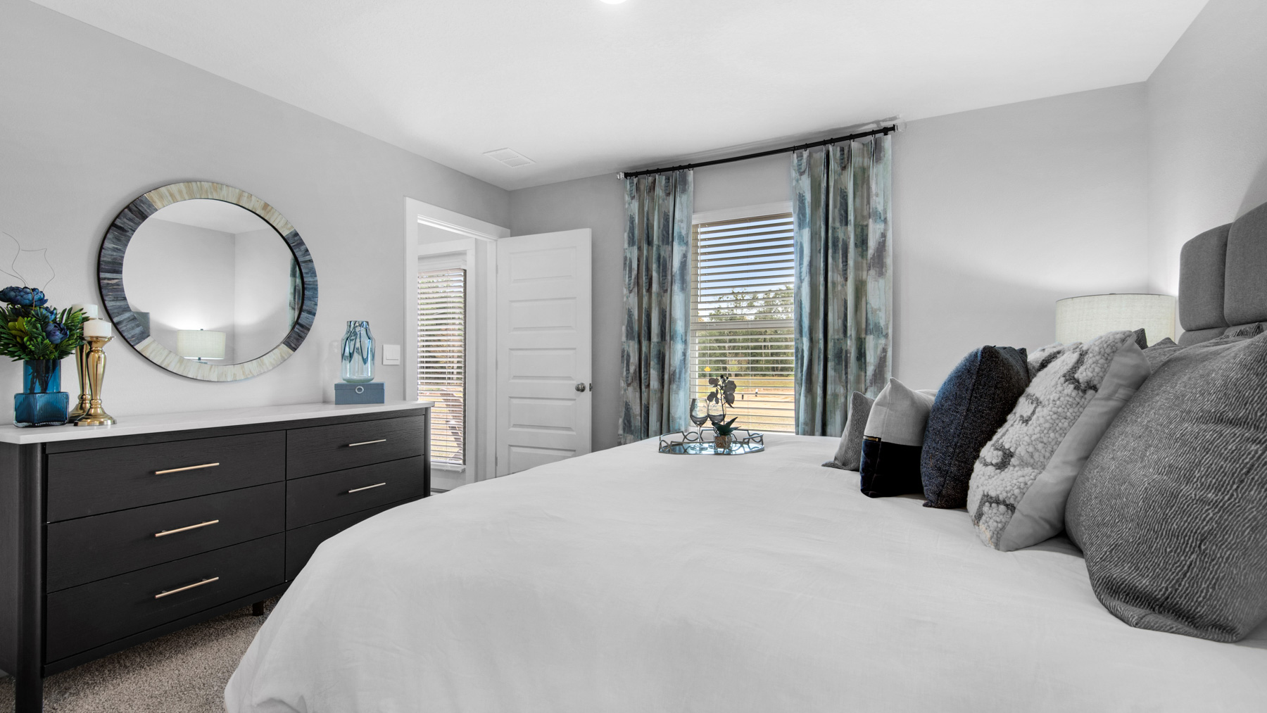 The primary bedroom is at the back of the home off the living area