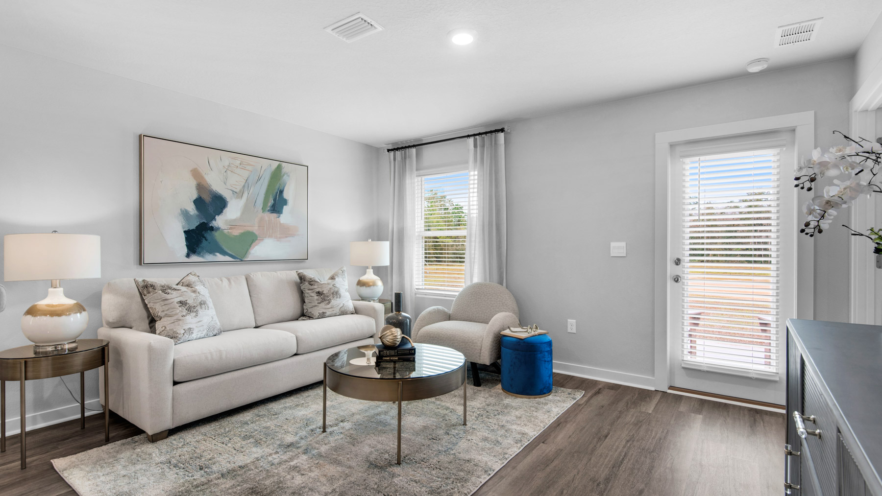 The living area has space for a sofa end tables and table