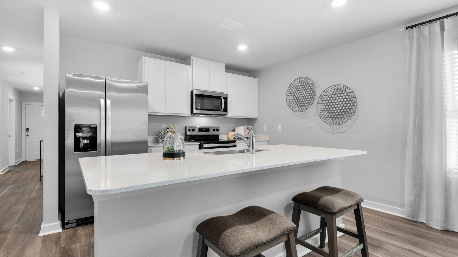 The kitchen has an island with space for bar seating