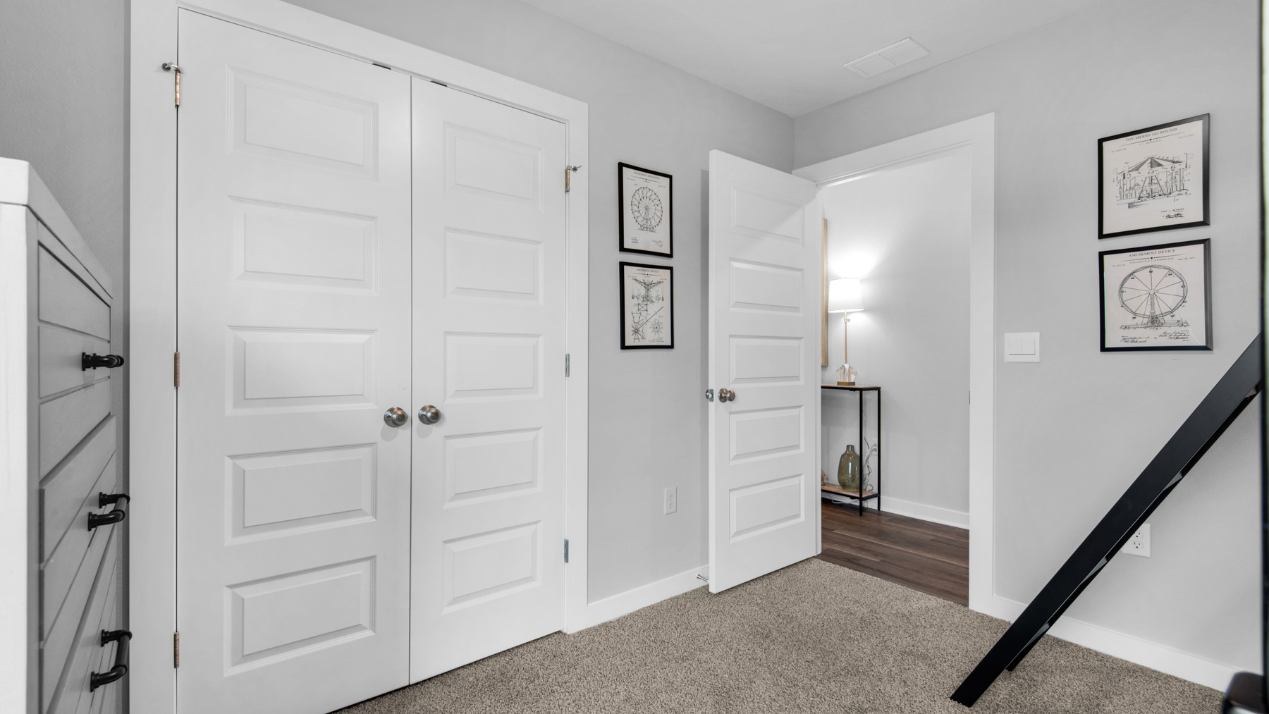 Guest bedroom two is staged with bunks and has carpet