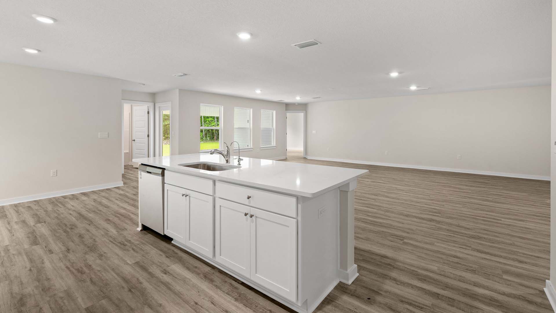 Open kitchen with center island featuring quartz countertops