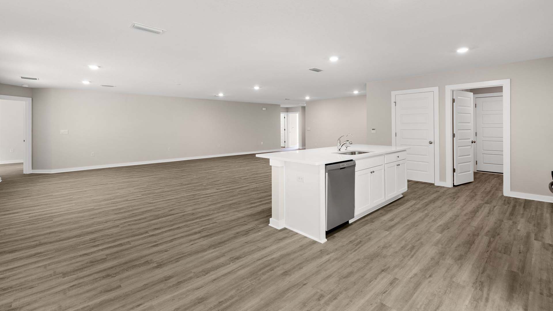 Open concept design with EVP flooring throughout the living area