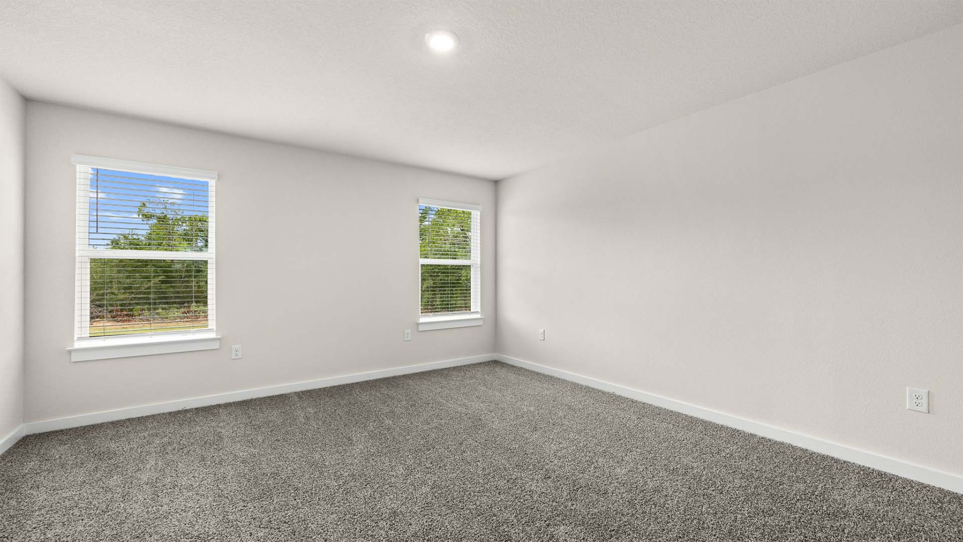 The primary bedroom is accessible from the living area