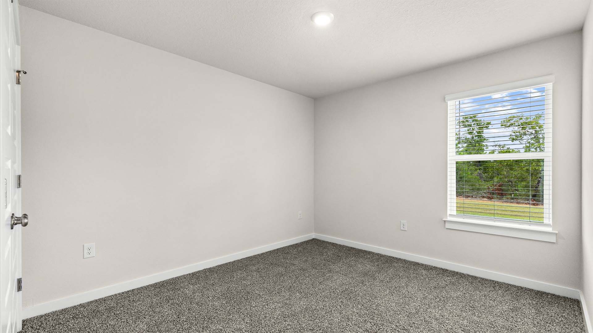One of the guest bedrooms is off the breakfast area