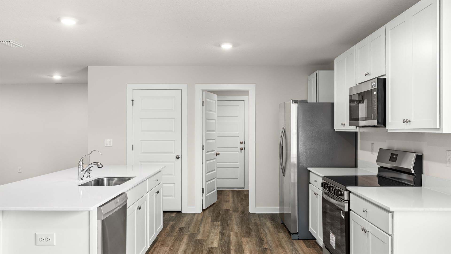 There is a laundry room and pantry off the kitchen