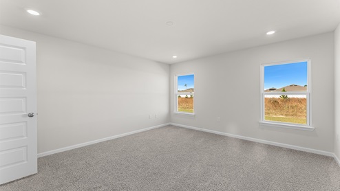 The primary bedroom is located off the living room