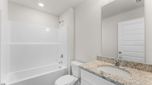 Shared bathroom of three guest bedrooms has a shower tub combination and single vanity