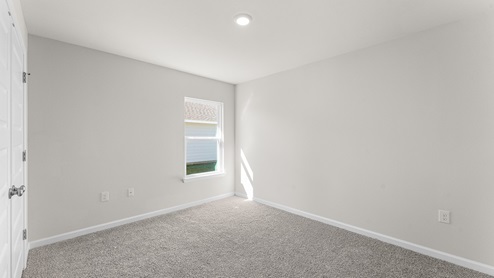 Guest bedroom two with carpet