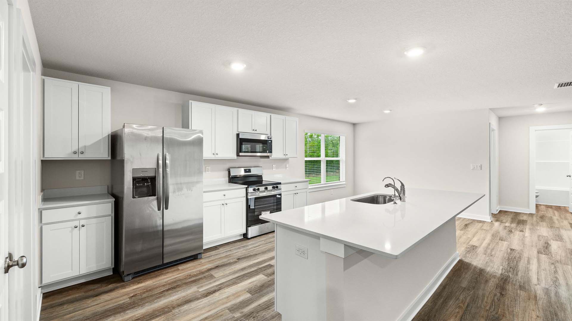 The kitchen offers plenty of storage