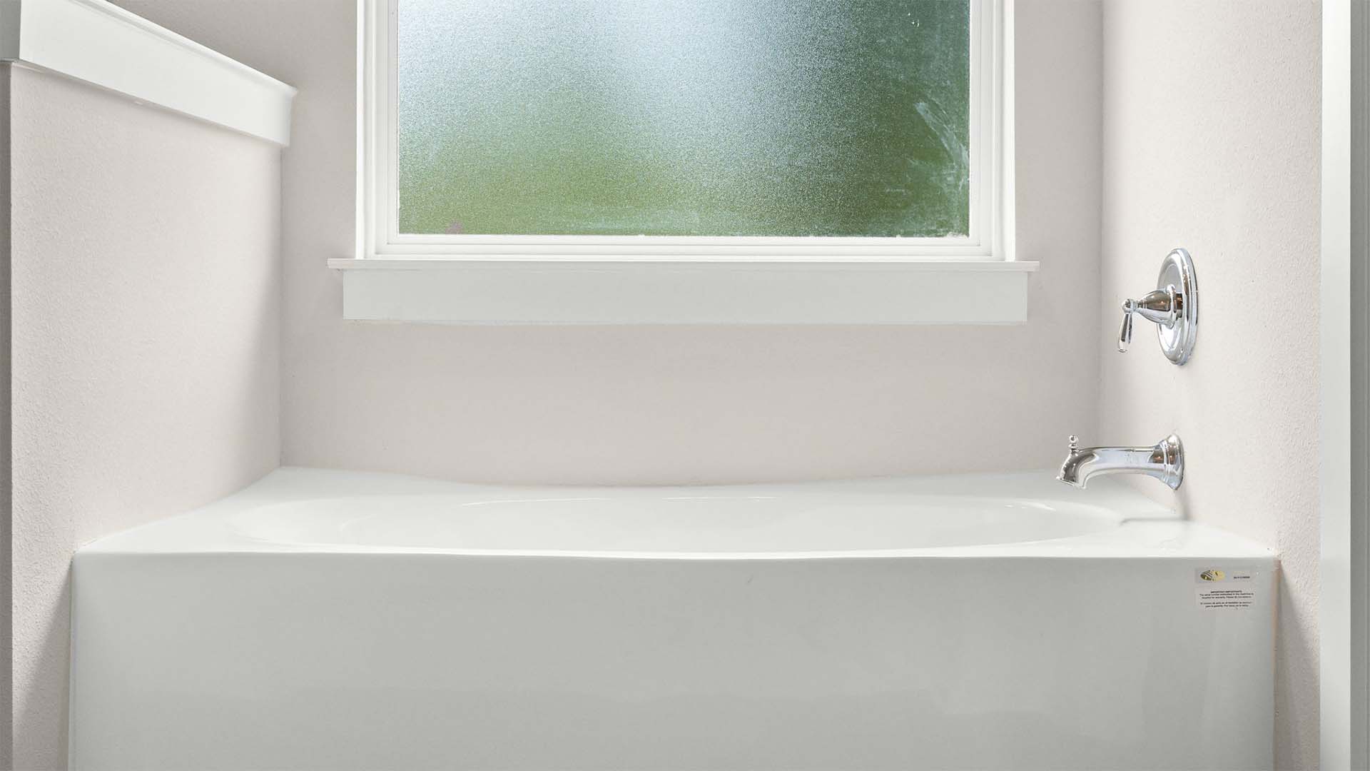 There is a soak tub and separate shower in the primary bathroom