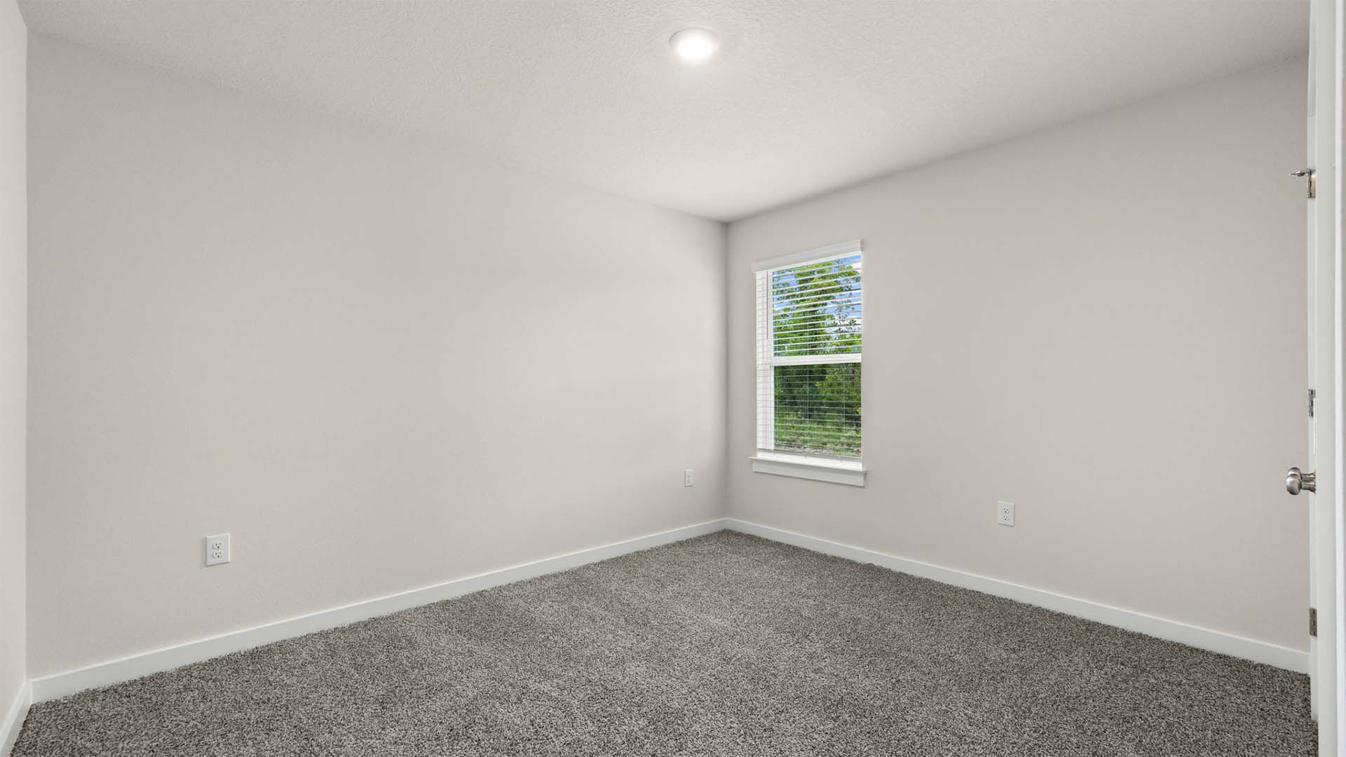 There are three guest bedrooms off the front entry hall