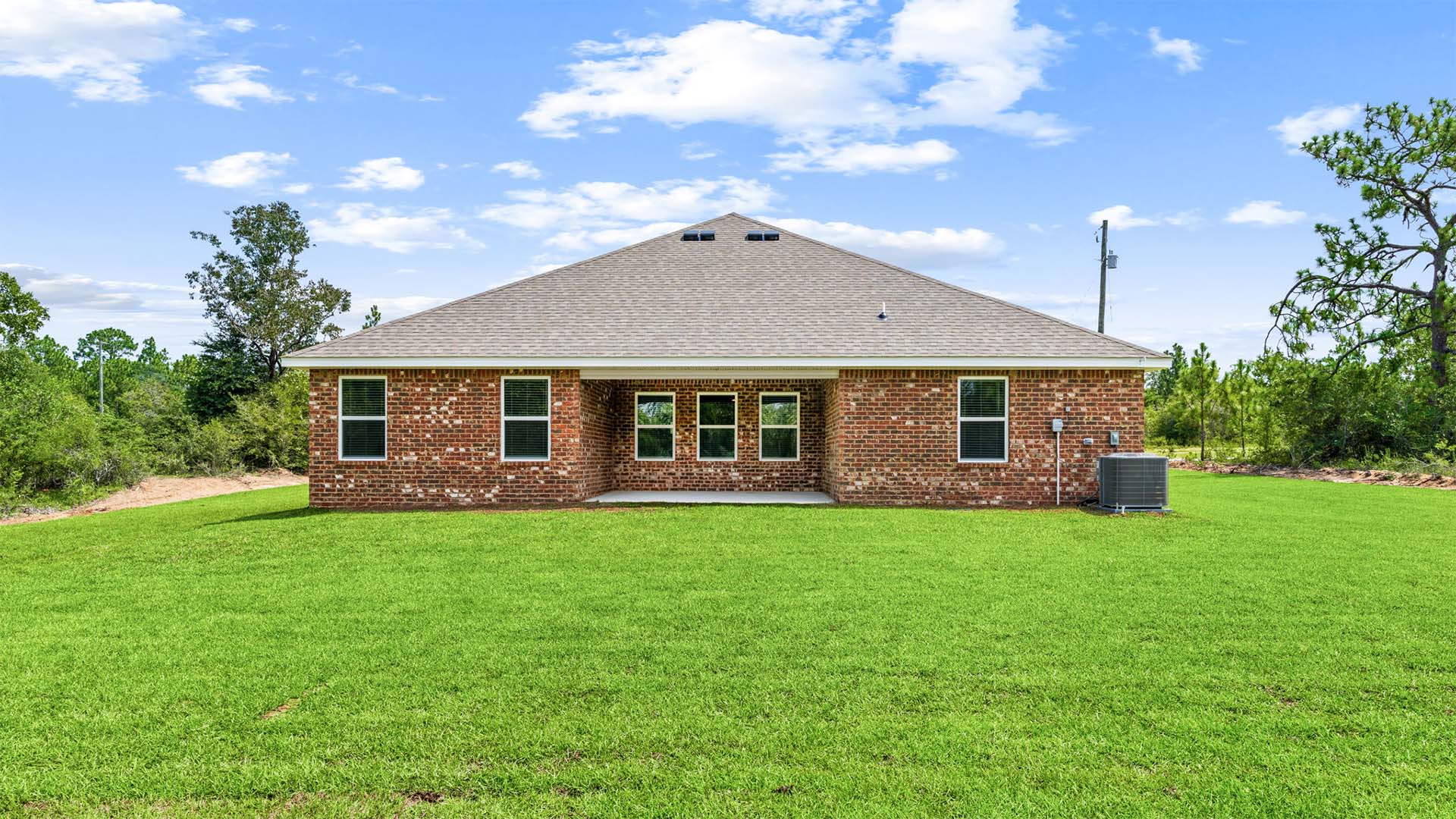 This image shows the back of the Sawyer that is constructed with brick siding on the sides and back of the home
