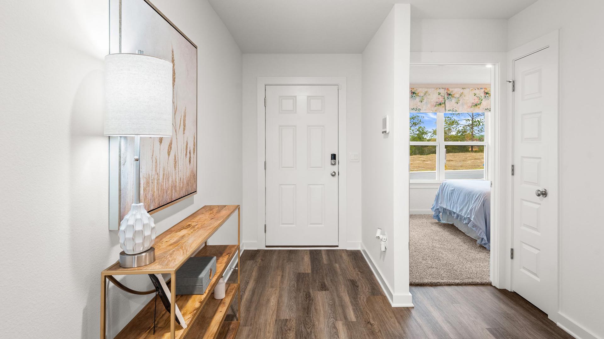 There are two bedrooms off the entry hall